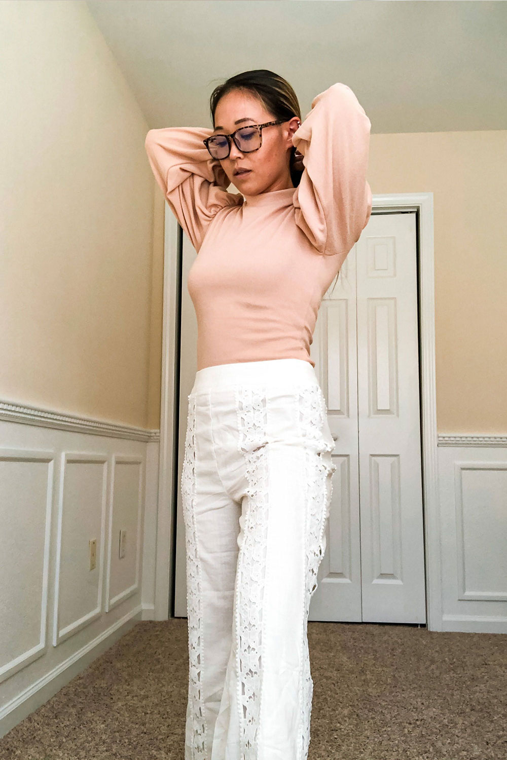 Flared bottom pants in white with lace accent paired with apricot bishop sleeve form fitting sweater